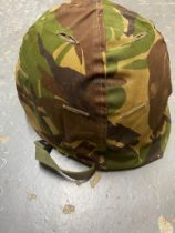 A USA Paratrooper Helmet with A Vietnam War Era Liner. The cover is Dutch with its original label.