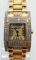 A Vintage Ingersoll Gold Plated and Diamond Ladies Watch. Gold plated and diamond bracelet. Tank