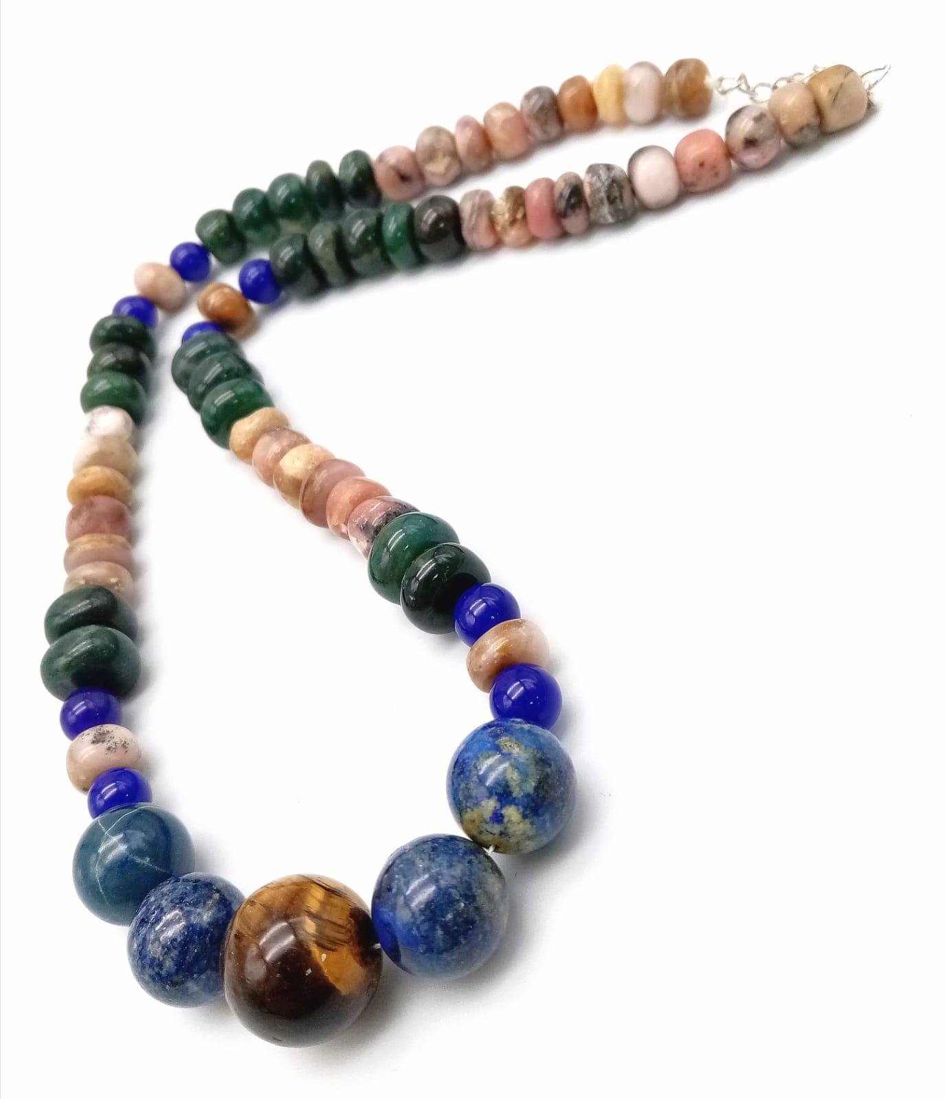 A Tigers Eye, Jade and Lapis Lazuli Necklace. A mixture of rondelle and round beads. Largest central - Image 3 of 3
