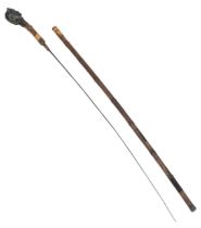 A striking Antique Bronze Headed Sword Stick. This well-aged bamboo stick with metal bottom