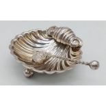STERLING SILVER ANTIQUE SHELL SHAPED DISH WITH MATCHING SHELL SHAPED MINITURE SPOON. HALLMARKED