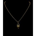 An Antique 9K Yellow Gold Floral Basket Pendant on a 9K Yellow Gold Small Belcher Link Necklace.