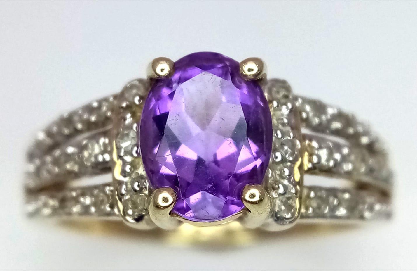 A 9K YELLOW GOLD DIAMOND & AMETHYST SET RING. Size N, 3g total weight.