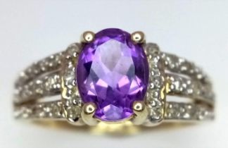 A 9K YELLOW GOLD DIAMOND & AMETHYST SET RING. Size N, 3g total weight.