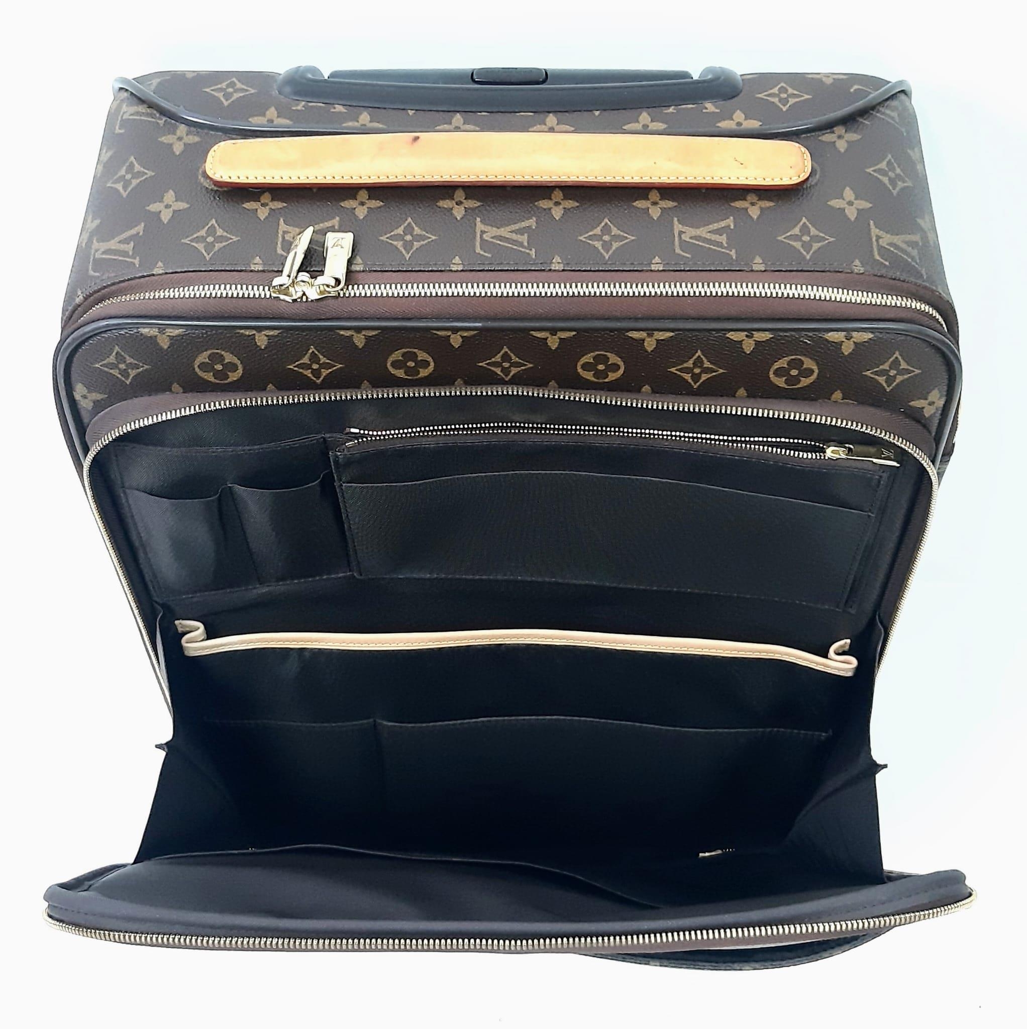 A Louis Vuitton Monogram Pegase Suitcase. Durable leather exterior. Front compartment with zipper, - Image 9 of 9