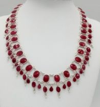A Ruby Gemstone Choker Necklace set in 925 Silver. Two rows of oval cut rubies. 38.58g total weight.