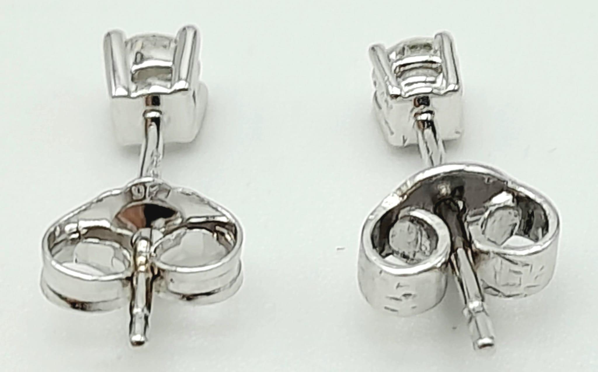 A Pair of 18K White Gold Diamond Stud Earrings. 1g total weight. - Image 2 of 3