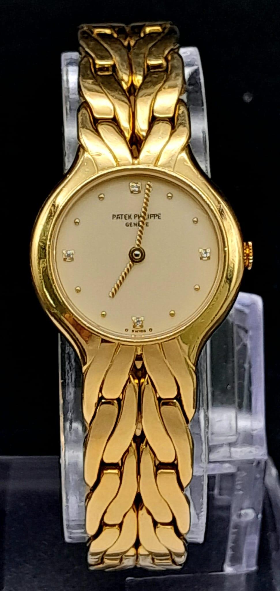 A Glorious 18K Yellow Gold Patek Philippe 'La Flamme' Ladies Watch. 18k gold bracelet and case -