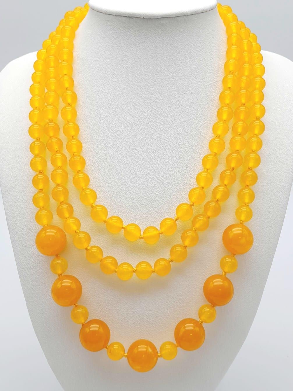 A Rope Length Yellow Jade Necklace with Different Sized Jade Beads - 8mm and 14mm. Necklace length -