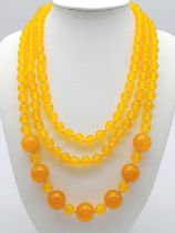 A Rope Length Yellow Jade Necklace with Different Sized Jade Beads - 8mm and 14mm. Necklace length -