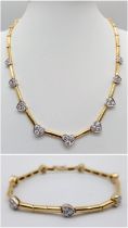 A Gorgeous 18K Gold and Heart-Diamond Necklace and Bracelet Set. The necklace is decorated with