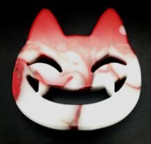 A Hand-Carved Natural Flame Agate Smiling Cheshire Cat Face. Ornament or paperweight. 8cm x 8cm.