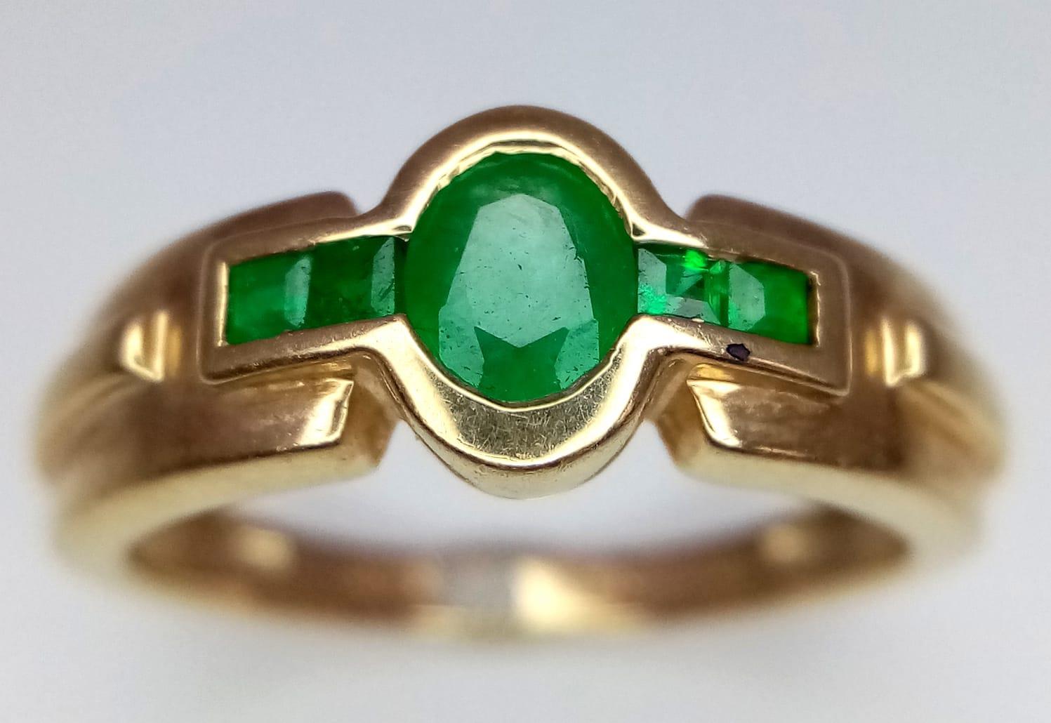 An Art Deco Style 9K Yellow Gold Emerald Ring. Size N. 2.72g total weight.