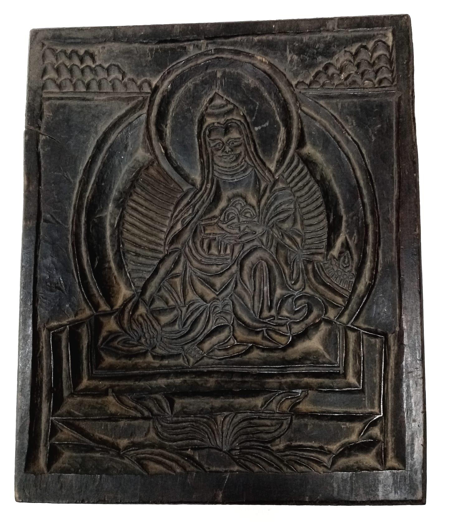 An Antique Tibetan Wood Wall Plaque. 24cm x 30cm