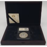 An Uncirculated Mint Condition 1921 Morgan Silver Dollar in Sealed Certified Capsule and Wooden