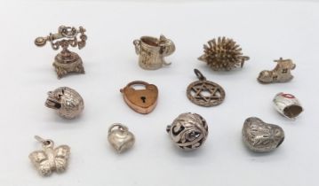 Assorted collection of white metal charms. 12 Charms in total. featuring a mouse climbing into a bin