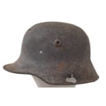 WW1 Battle Damaged German M16 Stahlhelm Helmet. This helmet was found in woodland in the Ypres