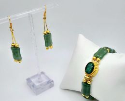 A wonderful, probably of Chinese origin, gilded green jade bracelet and matching earrings set,