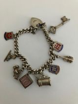 Vintage SILVER CHARM BRACELET Complete with safety chain. Charms to include Tankard, 10 shilling