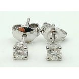 A Pair of 18K White Gold Diamond Stud Earrings. 1g total weight.