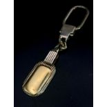 A Vintage Sterling Silver and 18K Gold Key Ring. Constructed from different parts of previous