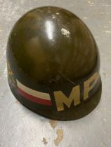 A USA Vietnam War Era Military Police Helmet. The liner is dated 1972. ML355.