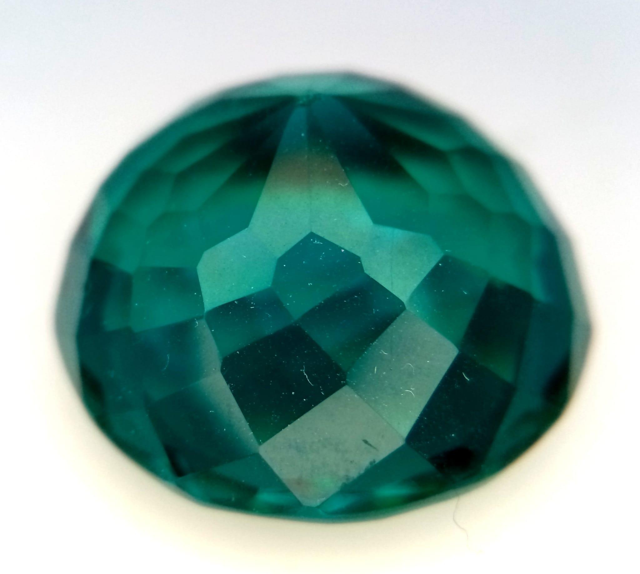 A Bluish Green 71ct Round Cut Grandidierite Gemstone. Round cut with a well faceted trillion base. - Image 2 of 2