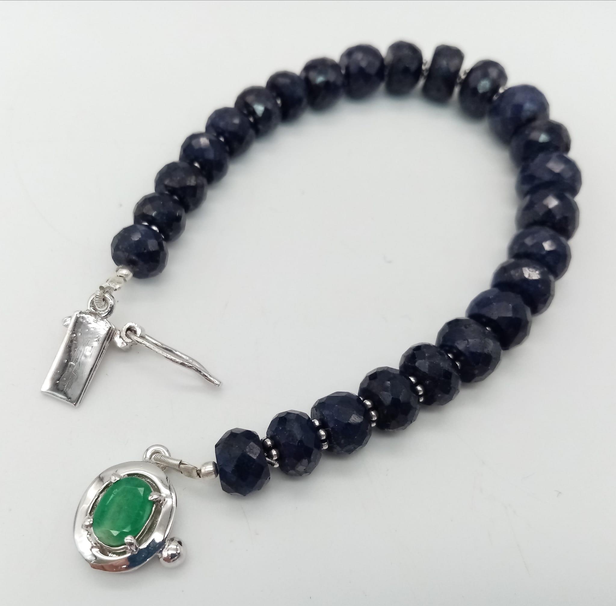 A 140ct Blue Sapphire Rondelle Bracelet with Emerald and 925 Silver Clasp. 17cm. - Image 2 of 4