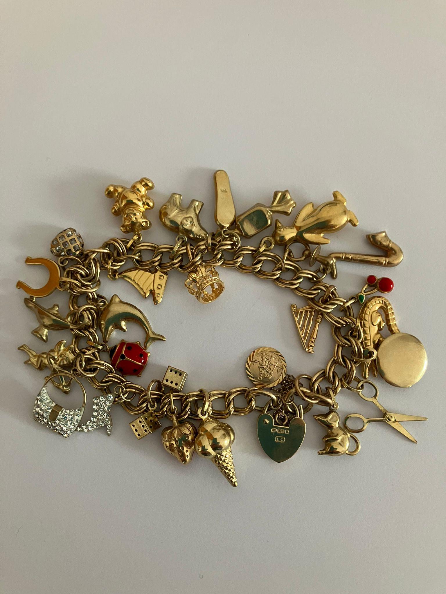 9 carat GOLD CHARM BRACELET Absolutely full of Gold charms, To include Dolphin, Ladybird, Magic - Image 4 of 6
