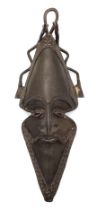 An Unusual Antique Bronze Tribal Oval Shaped African Mask. Serpent decoration at crown. 32cm x 14cm.