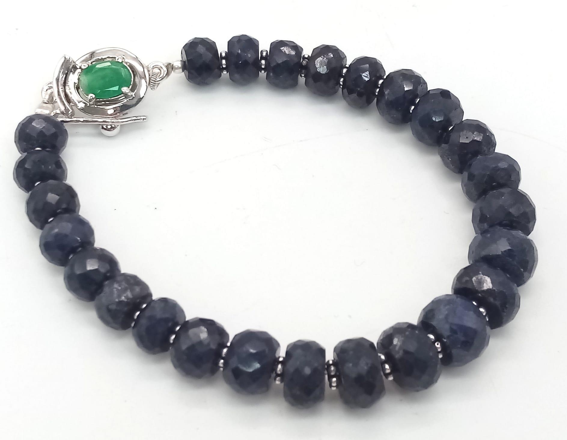A 140ct Blue Sapphire Rondelle Bracelet with Emerald and 925 Silver Clasp. 17cm. - Image 3 of 4