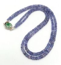 A Two Row Tanzanite Gemstone Necklace with an Emerald and 925 Silver Clasp. 45cm in length, 175ctw