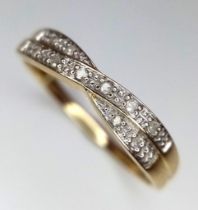 A 9K Yellow Gold Diamond Crossover Ring. Size P. 1.42g total weight.