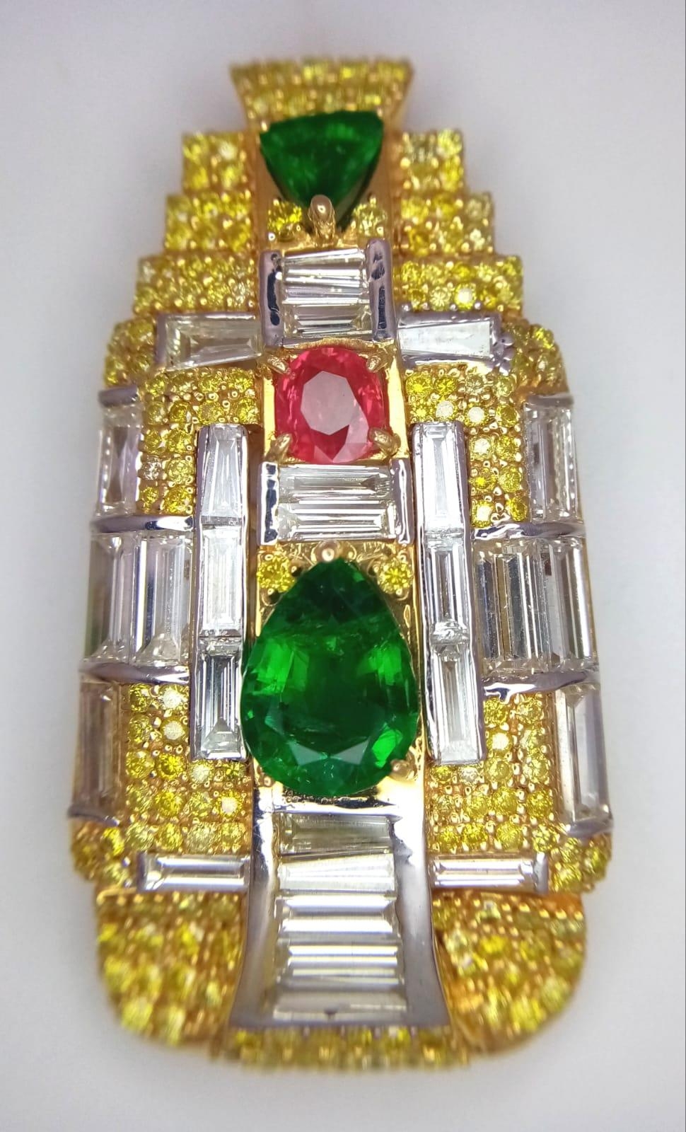 An Art Deco Style 18K Yellow Gold Gemstone Pendant - Set with two triangular emeralds and an oval