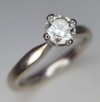 An 18K White Gold Diamond Solitaire Ring. Brilliant round cut diamond - 0.45ct approx. Size L. 4.14g