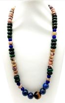 A Tigers Eye, Jade and Lapis Lazuli Necklace. A mixture of rondelle and round beads. Largest central