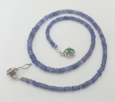 A 95ct Tanzanite Gemstone Single Strand Necklace with Emerald Clasp. 3mm beads set in 925 Silver.