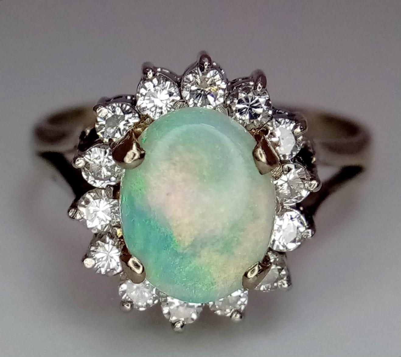 An 18K White Gold (tested) Opal and Diamond Ring. Central oval opal cabochon - 1ct approx, - Image 5 of 9