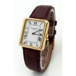 A Classic Patek Philippe 18k Gold Ladies Watch. Burgundy leather strap. 18k gold case - 22 x 25mm.