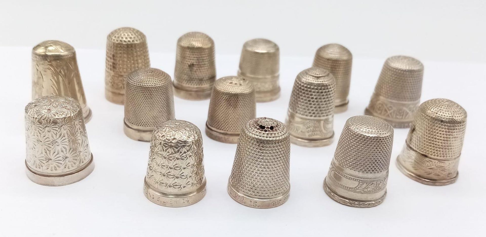 A Wonderful Collection of 14 Vintage/Antique Sterling Silver Thimbles. Different styles. Largest