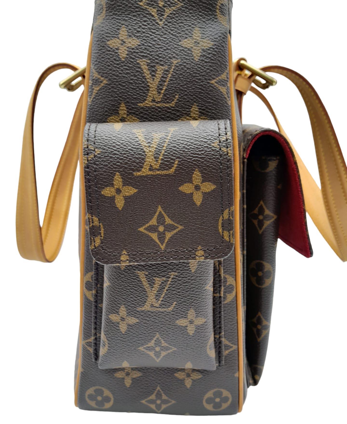 A Louis Vuitton Monogram Multiple Cite Bag. Leather exterior with gold hardware and top zip. Two - Image 5 of 10