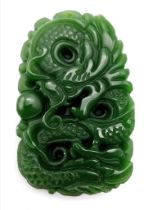 A Chinese Green Jade Carved Dragon Pendant. 5cm x 3cm