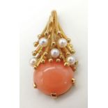 An 18K Yellow Gold (tested) Sea-Burst Coral and Pearl Pendant. A beautiful oval coral splashed