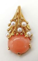 An 18K Yellow Gold (tested) Sea-Burst Coral and Pearl Pendant. A beautiful oval coral splashed