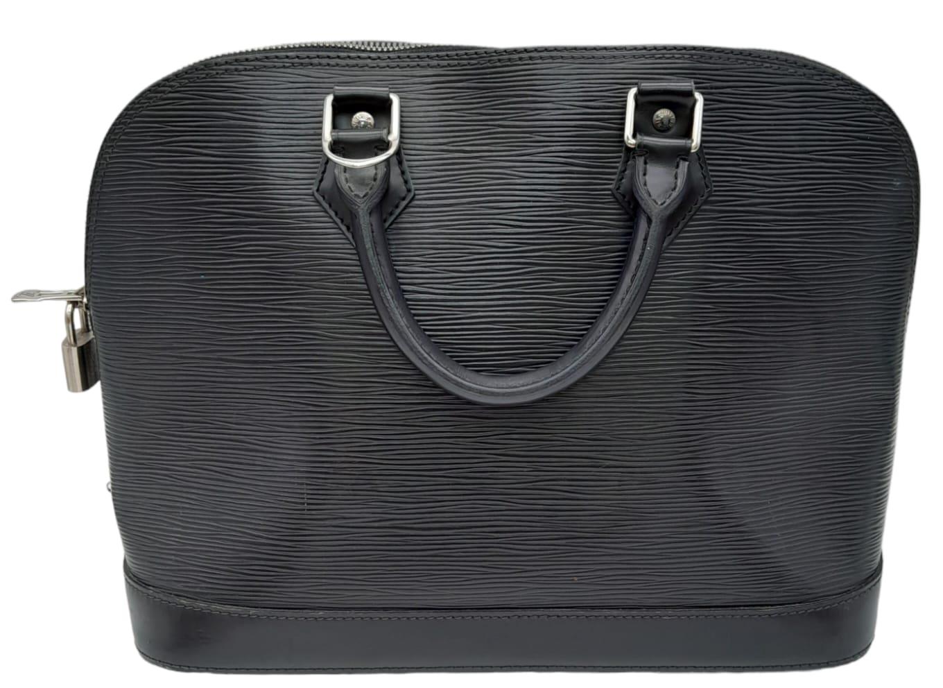 A Louis Vuitton Black 'Alma' Bag. Epi leather exterior with rolled handles, and silver-tone - Image 2 of 10