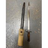 A Rare British 1907 Hooked Quillon Bayonet with Scabbard. The blade is dated 1913. It has original