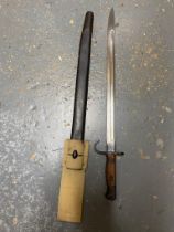 A Rare British 1907 Hooked Quillon Bayonet with Scabbard. The blade is dated 1913. It has original