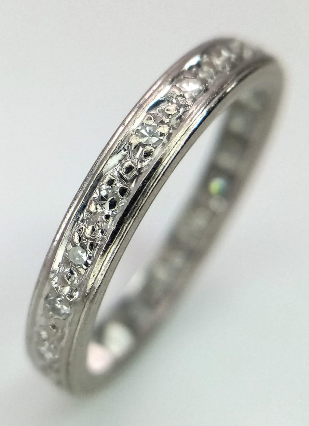 A VINTAGE 18K WHITE GOLD DIAMOND FULL ETERNITY RING. Size L/M, 2.9g total weight.