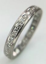 A VINTAGE 18K WHITE GOLD DIAMOND FULL ETERNITY RING. Size L/M, 2.9g total weight.