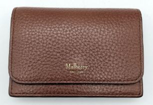A Mulberry Brown Coin Purse/Card Holder. Pebbled leather exterior. Flap opening with press stud